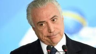 Mr Temer has been accused of receiving $12m (£9m) in bribes. AFP