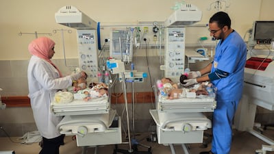 Palestinian medics care for premature babies evacuated from Gaza city's Al Shifa Hospital before their transfer to Egypt. AFP