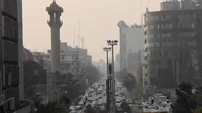 A general view shows vehicles drive through heavy smog in Tehran. EPA