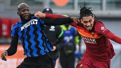 Roma defender Chris Smalling holds off Inter's Romelu Lukaku. AFP