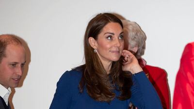Underneath the Mulberry coat, the Duchess of Cambridge wears a Jenny Packham dress. Reuters