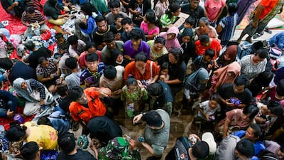 North Sumatra Governor Bobby Nasution distributes meals to displaced residents at a shelter. AFP