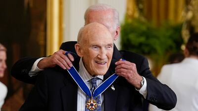 Mr Biden awards former Wyoming senator Alan Simpson. AP