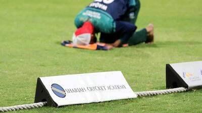 Players pray before the Sharjah Ramadan Cup game between MGM Cricket Club and Pacific Group