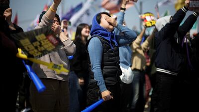 People react after President Yoon Suk Yeol's impeachment was accepted near the Constitutional Court in Seoul. Reuters