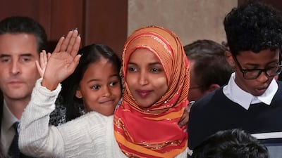 Rep. Ilhan Omar, center, a freshman Democrat representing Minnesota's 5th Congressional District, is sworn in on the House floor by new House Speaker Nancy Pelosi on the first day of the 116th Congress, ,. AP