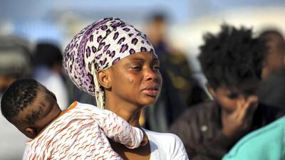 A mother and child rescued with other migrants from an inflatable boat off the coast of Zawiyah, Libya. AFP