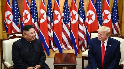 US President Donald Trump talks with North Korean leader Kim Jong-un. AFP