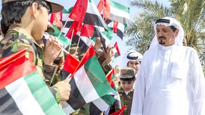 Sheikh Humaid bin Rashid, Ruler of Ajman and Sheikh Ammar bin Humaid, the Crown Prince, attend Flag Day celebrations in the emirate. WAM