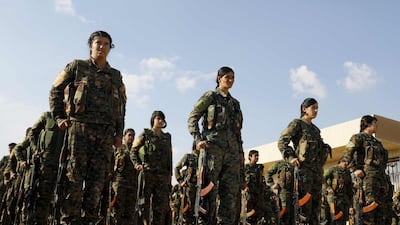 Fighters from the Syrian Democratic Forces parade at the funeral of a fellow fighter in the Kurdish-controlled city of Qamishli in north-eastern Syria. AFP