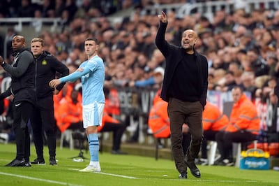 Manchester City manager Pep Guardiola, right, during the League Cup defeat at Newcastle. PA