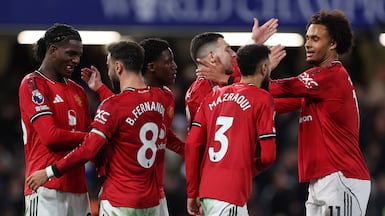 Manchester United players celebrate their 1-0 win at Chelsea. EPA