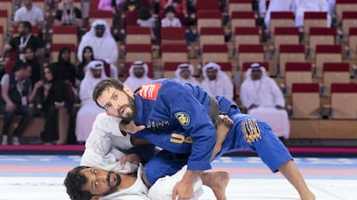 UAE's Talib Al Kirbi, in white, was beaten by Braziilian Thiago Marques at the Abu Dhabi World Professional Jiu-Jitsu Championship at Mubadala Arena. All photos by Reem Mohammed / The National