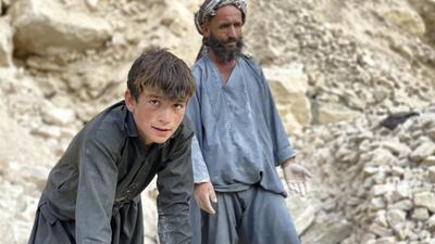 Mohammad Naeem, 45, and his son Faizmad, 16, work together at a mine in the northern Afghan province of Samangan. Hikmat Noori for The National