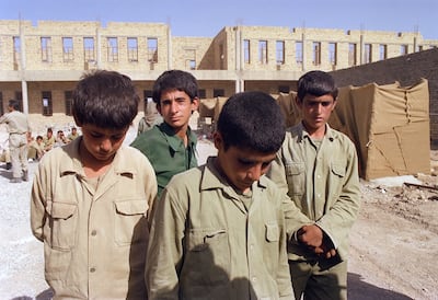Captured Iranian youths under guard on the Iraq-Iran border on June 20, 1988. Tens of thousands of Iranian children were killed in combat during the 1980-1988 Iran-Iraq war. AFP