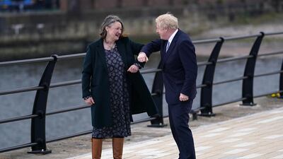 Boris Johnson elbow bumps Jill Mortimer at the National Museum of the Royal Navy, in Hartlepool Marina. Getty Images