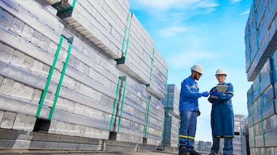Emirates Global Aluminium employees check inventory at the company's cast-house yard. Photo: EGA