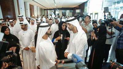 Sheikh Mohammed bin Rashid, Vice President and Ruler of Dubai, speaks to Mohammed Al Mahmood, Chairman and Managing Director of Abu Dhabi Media during the Emirates Media Forum in Dubai. Courtesy Al Ittihad