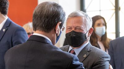 President Anastasiades embraces King Abdullah II.