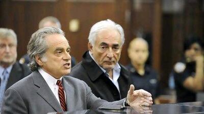 Dominique Strauss-Kahn, the head of the IMF, right, with his lawyer Benjamin Brafman, was refused bail by a New York court. Andrew Gombert / Bloomberg News
