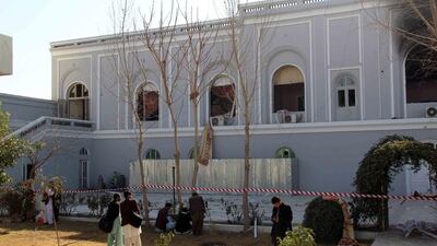 Afghan journalists are pictured at the site of the bomb blast that targeted the governor's guesthouse in Kandahar, Afghanistan, on January 11, 2017. Muhammad Sadiq/EPA