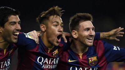 Luis Suarez, left, Neymar, centre and Lionel Messi have combined for 82 goals and 47 assists for Barcelona this season. Lluis Gene / AFP
