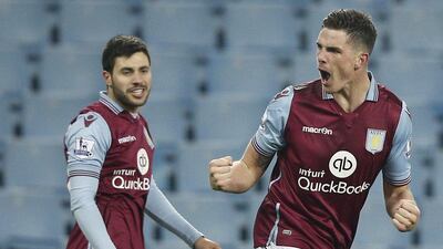 Ciaran Clark, right, celebrates after scoring the opening goal for Aston Villa against Wycombe. Adrian Dennis / AFP