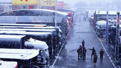 The Red Bull Racing team arrive at the circuit in snowy conditions during day three of F1 Winter Testing at Circuit de Catalunya. Charles Coates/Getty Images