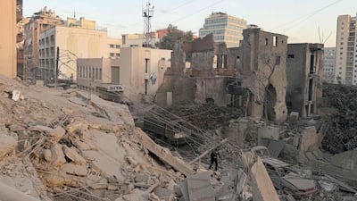 A man walks past rubble at the site of the Israeli air strike in Bachoura. AFP