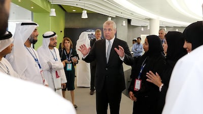 Prince Andrew, Duke of York, talks to entrepreneurs during the Pitch@Palace competition held at the Khalifa University in Abu Dhabi. Pawan Singh / The National