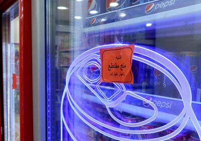 A sign reading: ' Warning: This product is boycotted. The choice is yours. ' is seen at a supermaket in Amman. Reuters