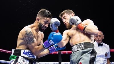 Bader Samreen throws an uppercut against Jose Paez Gonzales.