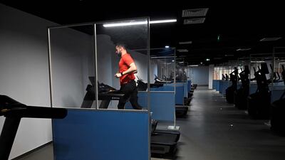 An athlete uses treadmill in the fitness centre at Beijing 2022 Winter Olympic Games village. AFP