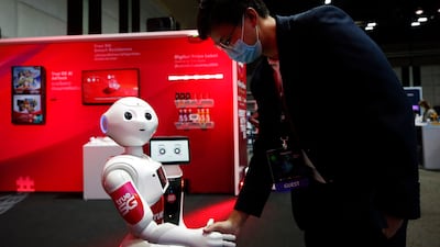 A robot interacts with a visitor during a Thai summit on superfast connectivity. Artificial intelligence and the expansion of the middle class in Asia are major opportunities for investors. EPA