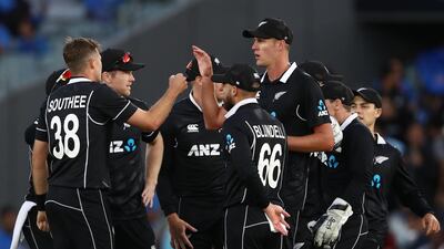 Tim Southee celebrates the wicket of Virat Kohli of India with his team-mates. Getty