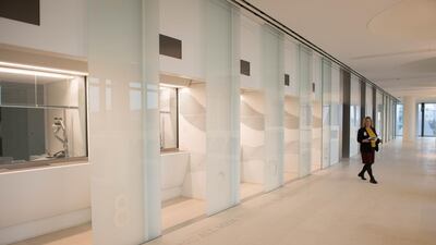 A person walks inside the visa hall prior to the unveiling of the new US Embassy building in London. Stefan Rousseau - WPA Pool / Getty Images