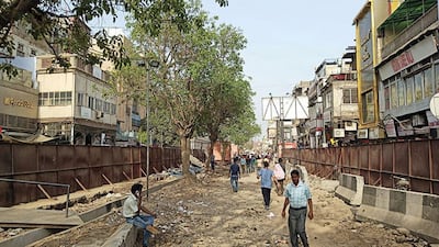 Chandi Chowk is getting a revamp: on the left is an artist's rendering of how it will look after its makeover, on the right is the street as it appears today.