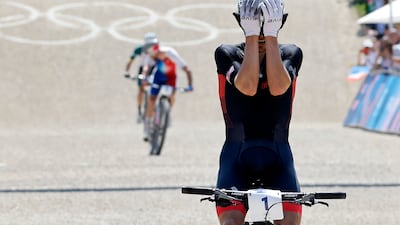 Tom Pidcock crosses the line to take the gold ahead of Victor Koretzky of France. EPA