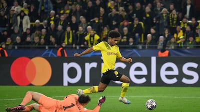 Karim Adeyemi goes around Chelsea's Kepa Arrizabalaga to score. Getty