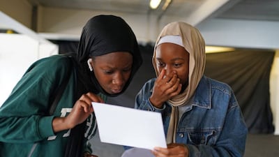 Hajara Yousouf, right, and a friend open their GCSE results at Core's City Academy in Birmingham.