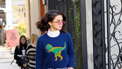 Selena Gomez in Los Angeles wearing a Coach Rexy sweater. Courtesy of Coach