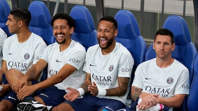 Paris Saint-Germain's Marquinhos (2l), Neymar and Lionel Messi sit on the bench at the start of a the match against J1 league club Urawa Reds at Saitama Stadium, north of Tokyo, Japan, on July 23, 2022. EPA