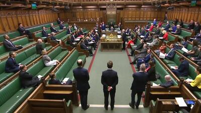 A video grab from footage broadcast by the UK Parliament shows MPs sitting in a largely empty chamber as Prime Minister's Questions starts in the House of Commons in London on March 18, 2020. AFP Photo / PRU