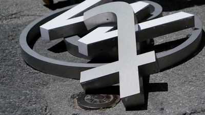 Characters removed from a sign on the Twitter headquarters building piled on a street in San Francisco on July 24. AP