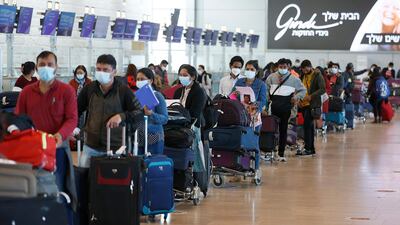 Passengers queue at the check-in counter ahead of their flight to India at Israel's Ben Gurion Airport near Tel Aviv. AFP