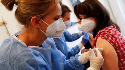 Doctors give doses of the Pfizer-BioNTech vaccine in Germany, where health officials say the Delta variant is gaining ground. Reuters