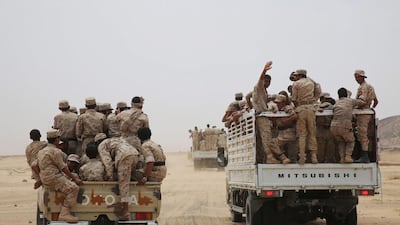 Yemeni army soldiers ride on trucks as they escort Yemen's vice president Ali Muhssien Al Ahmar in the central province of Marib. Reuters