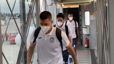Fuenlabrada players arriving at the airport in A Coruna on July 20. 2020 Their match against Deportivo la Coruna was suspended after several of their players tested positive for Covid-19. EPA