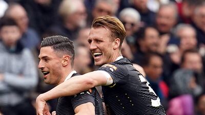 Schar celebrates scoring with team-mate Dan Burn. PA