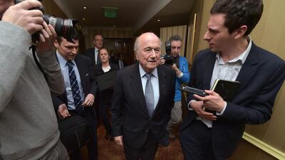 Fifa president Sepp Blatter, centre, exits the meeting to face questions from reporters at the International Football Association Board AGM at the Culloden Hotel on February 28, 2015 in Belfast, Northern Ireland. (Photo by Charles McQuillan/Getty Images)